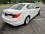 Rear view of a 2012 Honda Accord LX-P in white with new tires and aluminum alloy wheels parked.