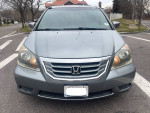 Front view of a 2009 Honda Odyssey EXL minivan, showing its condition and features for sale.