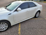 2013 Cadillac CTS 4 AWD Luxury Collection in pearl white with new tires and brakes, parked.