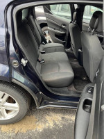 Interior view of a 2012 Dodge Avenger SXT showing spacious back seats and upholstery.