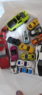 Metal toy cars, both small and large sizes