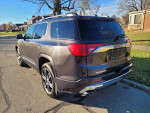 2017 GMC Acadia Denali FWD with leather seats, sunroof, and backup camera parked on the street.