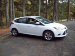 2013 Ford Focus SE hatchback in great condition parked on a road surrounded by trees