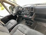 Interior view of a used Promaster 1500 diesel van with 234,000 miles, showing the dashboard and seating.