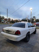 2001 Crown Victoria with a 6-inch lift and Falken AT3W tires parked on the street