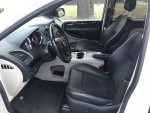 Interior view of 2019 Dodge Grand Caravan SXT minivan with black seats and modern dashboard features.