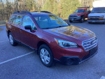 2016 Subaru Outback in maroon color parked, highlighting low mileage and all-wheel drive features.