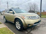 2007 Nissan Murano S FWD in excellent condition with new snow tires and low mileage, parked on street.