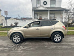 Side view of a 2007 Nissan Murano S in excellent condition, parked outdoors with a clean exterior and new snow tires.