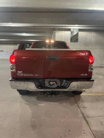 Rear view of a 2008 Toyota Tundra 4x4 in red, showcasing its XSP package design.