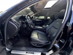 Interior view of a black Infiniti Q50 sedan showcasing leather seats and modern dashboard features.