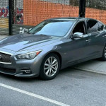 Grey INFINITI Q50 premium car parked with leather interior and sunroof, featuring all-wheel drive and heated seats.