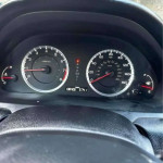 Dashboard view of a Honda Accord displaying mileage and other metrics, showcasing a clean and well-maintained vehicle.
