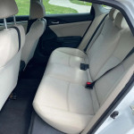 Interior view of 2017 Honda Civic Sport showing clean backseat and seatbelts