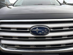Front grill of a 2017 Subaru Outback 2.5i with emblem, showcasing its sleek design.