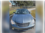 Front view of a 2010 Chrysler Sebring Limited with 141,000 miles on the odometer.