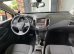 Interior view of a 2014 Chevrolet Cruze 1LT, featuring dashboard and seating in excellent condition.