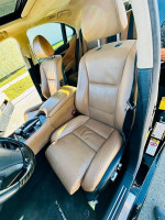 Interior view of a 2013 Lexus LS 460 L showcasing comfortable leather seats.