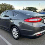 2015 Ford Fusion in great condition, gray exterior, clean title, runs smoothly, equipped with reverse camera.