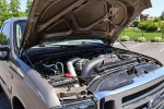 2005 Ford F-250 Super Duty XLT engine compartment with 6.0L V8 turbodiesel, showcased under the hood