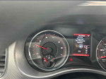 Dashboard of a 2014 Dodge Charger R/T showing RPM and service alert at 161,105 miles.
