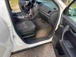 Interior view of a 2014 Chevrolet Camaro LS with gray seating and modern dashboard features.