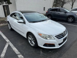 2009 Volkswagen CC Luxury sedan in white parked, featuring leather seats and a sunroof.