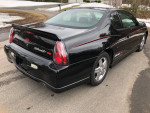 2004 Chevrolet Monte Carlo SS Intimidator Edition, black exterior, showcasing rear design and sporty features.