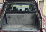 Interior of 2007 Honda Pilot EX FWD showing spacious cargo area with folded back seats