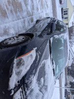 2012 Nissan Altima 2.5 FWD parked with snow on the windshield, showing low mileage and clean title details.