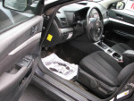 Interior view of a 2012 Subaru Outback 2.5i AWD with manual transmission and clean upholstery