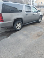 2007 Chevrolet Suburban 4X4 parked, showing minimal rust and recent bodywork, ready for inspection.