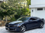 2013 Chevrolet Camaro RS Coupe in dark midnight blue, showcasing its sporty design and sleek silhouette