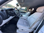 Interior view of a 2010 Chevrolet Silverado 1500 LT 4WD with cloth seats and modern dashboard features.
