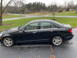 2013 black Mercedes-Benz C300 4MATIC parked on driveway, clean and well maintained with 195,000 miles.