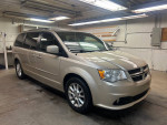 2013 Dodge Grand Caravan with 87,000 miles, showcasing its clean interior and stylish exterior.
