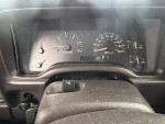 Interior dashboard of a 2000 Jeep Cherokee showing gauges and controls, indicating mileage and performance.