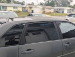 2007 Chevrolet Malibu hatchback with tinted windows and minor cosmetic wear, parked in a residential area.