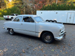 1949 Ford Custom 2 Door Sedan with 57,000 original miles in excellent condition, showcasing classic style and quality.
