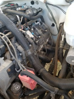 Engine components of a 2003 Chevrolet 1500HD crew cab truck with upgraded parts and modifications.