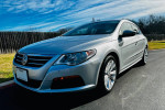 2011 Volkswagen CC Sport in silver, showcasing its sleek design and excellent condition, parked outdoors.