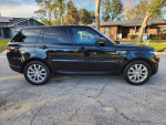 2017 Land Rover Range Rover HSE V6 black SUV side view parked on a residential street