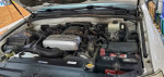 Engine compartment of a 2005 Toyota 4Runner SR5 4WD showcasing the V8 4.7L engine and components.