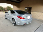 2011 Hyundai Sonata Limited in silver, parked outside, showcasing clean design and modern features