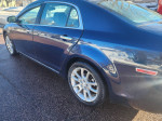 2009 Chevrolet Malibu LTZ, metallic blue, V6 engine, 114,000 miles, featuring leather interior and sunroof.