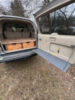 Interior view of a 2006 Lexus GX 470 showing rear storage and custom modifications.
