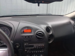 Dashboard of a 2007 Pontiac Grand Prix showing mileage of 206,000 and a sleek interior design.