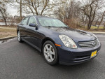 2004 Infiniti G35 AWD sedan in dark blue, clean exterior, low mileage, parked on a road
