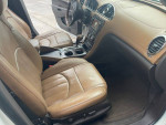Interior view of a 2013 Buick Enclave with leather seats and modern dashboard controls.