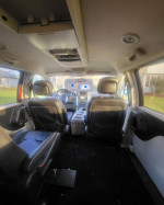 Interior view of a well-maintained 2014 Chrysler Town & Country mini van with spacious seating.